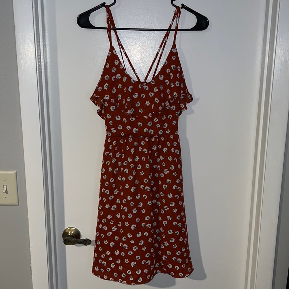 Rust colored mid length dress. Floral. US size small